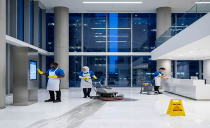 Cleaning team performing high-access window cleaning